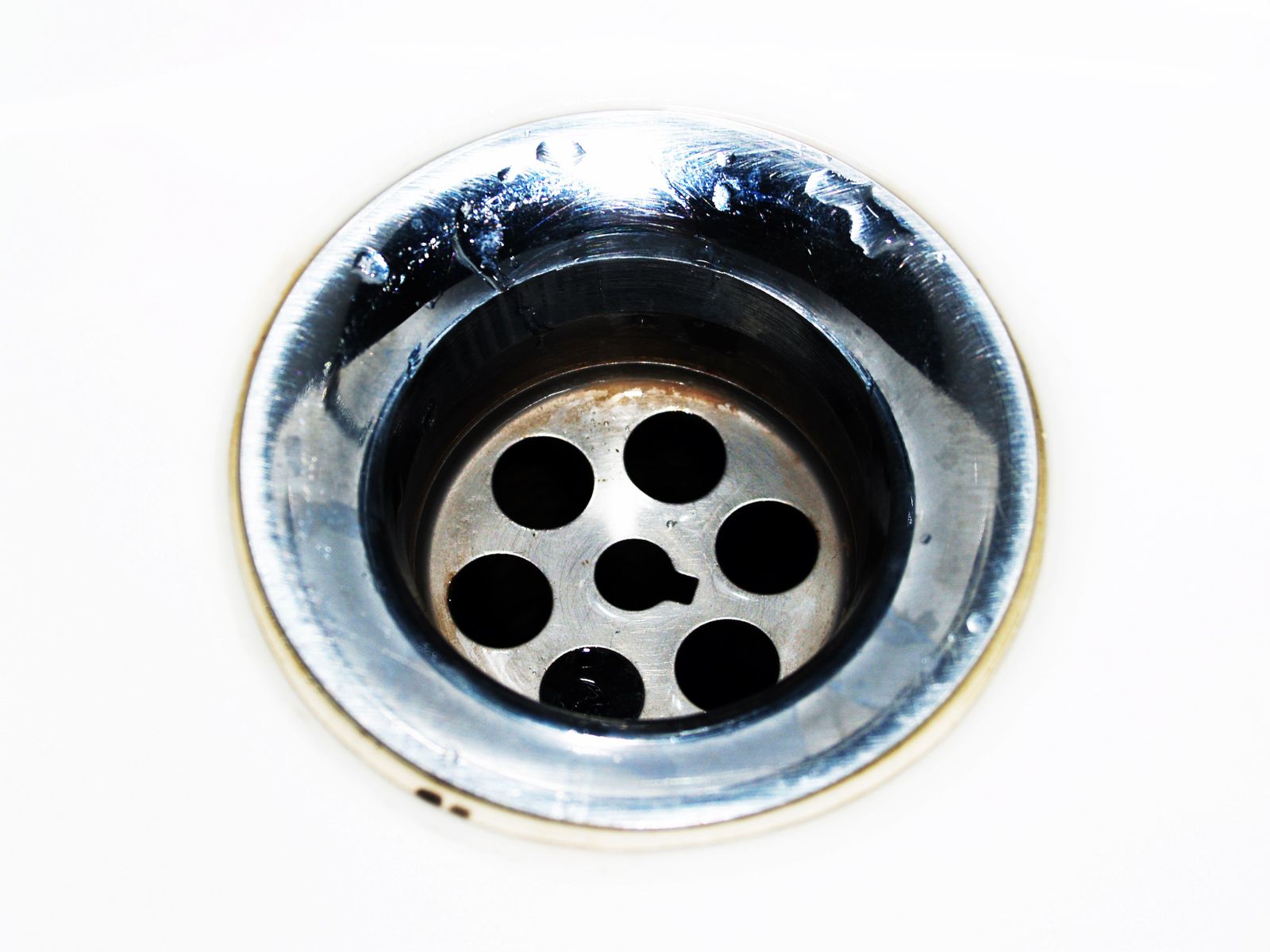 Kitchen sink drain being cleared by a plumber in New Smyrna Beach FL
